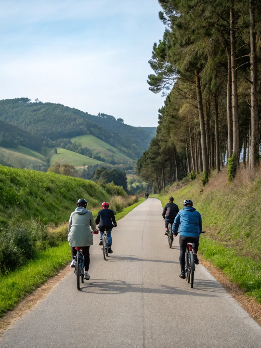 An image of experienced cyclists leading a group ride through the scenic routes of Vernon, highlighting the club's guided tours and exploration of the local area.