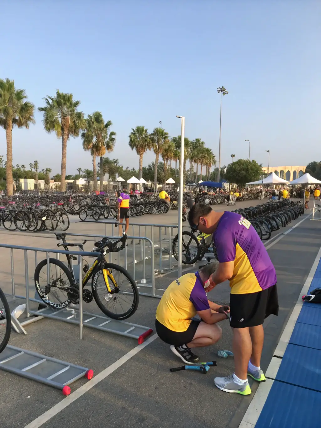 Volunteers from VELO CLUB VERNONNAIS assisting with a community bike repair event, demonstrating the club's commitment to promoting sustainable transportation and supporting local cyclists.